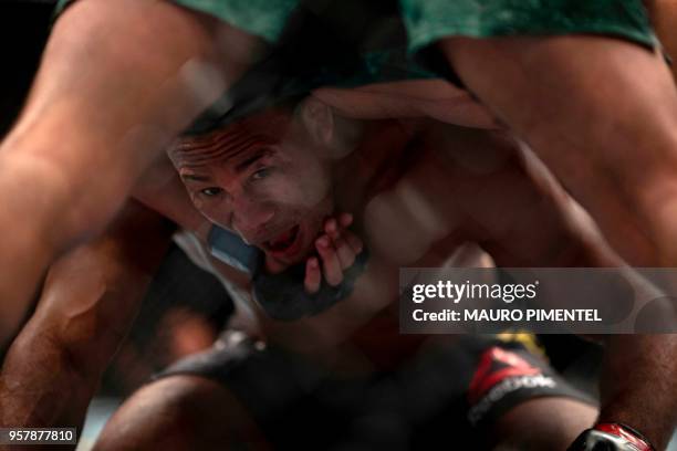 Brazilian fighter Ronaldo Souza "Jacare" competes against US fighter Kelvin Gastelum during their middleweight bout at the Ultimate Fighting...