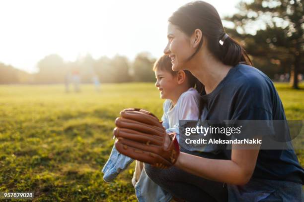 getting ready for the little league - softball sport stock pictures, royalty-free photos & images