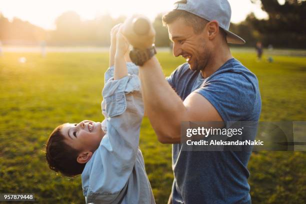 having fun during baseball game - playing catch stock pictures, royalty-free photos & images