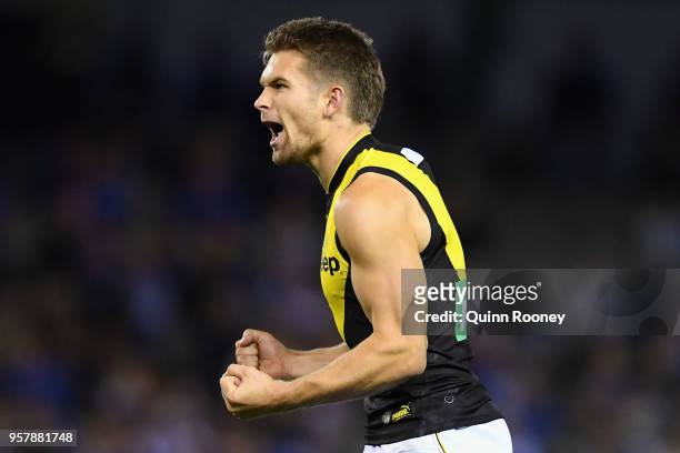 Dan Butler of the Tigers celebrates kicking a goal during the round eight AFL match between the North Melbourne Kangaroos and the Richmond Tigers at...