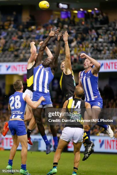 Majak Daw of the Kangaroos jumps for the ball during the round eight AFL match between the North Melbourne Kangaroos and the Richmond Tigers at...