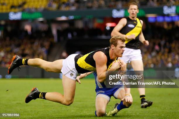 David Astbury of the Tigers marks the ball during the round eight AFL match between the North Melbourne Kangaroos and the Richmond Tigers at Etihad...