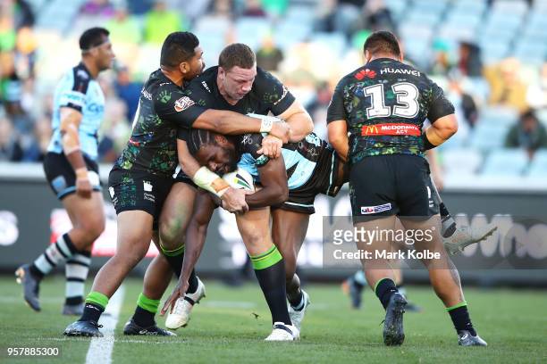 Edrick Lee of the Sharks is tackled during the round 10 NRL match between the Canberra Raiders and the Cronulla Sharks at GIO Stadium on May 13, 2018...