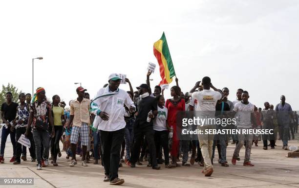 Supporters cheer for Union for the Republic and Democracy (Union pour la république et la démocratie, leader Soumaïla Cissé as they arrive at a rally...