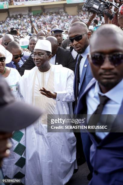 Union for the Republic and Democracy (Union pour la république et la démocratie, leader Soumaïla Cissé waves as he greets supporters at a rally...