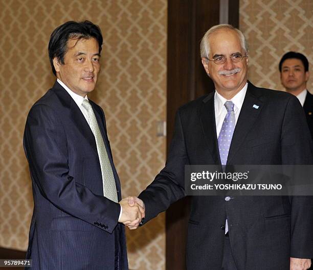 Argentine Foreign Minister Jorge Taiana shakes hands with his Japanese counterpart Katsuya Okada prior to their talks at the Iikura guesthouse in...