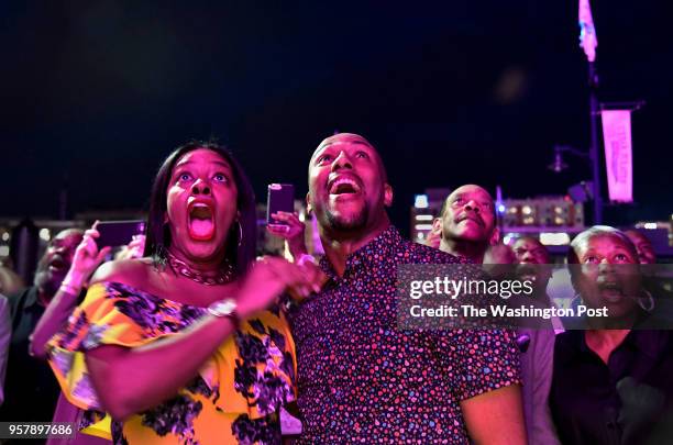 Johnna Rowe and Cameron French had been nervously waiting as the lights alternated between blue and pink on the Capitol Wheel. Then the lights stayed...