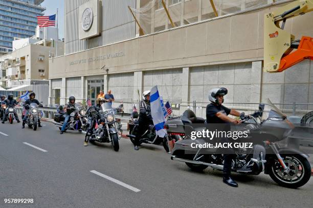 Israeli motorcycle club, Samson Riders, lead a convoy of Harley Davidson riders in the streets of Tel Aviv on May 13 as they ride from the current...