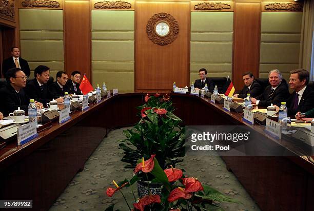 Chinese Foreign Minister Yang Jiechi talks with Germany's Vice Chancellor and Foreign Minister Guido Westerwelle during a meeting at the Diaoyutai...