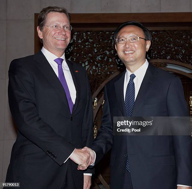 Chinese Foreign Minister Yang Jiechi shakes hand with Germany's Vice Chancellor and Foreign Minister Guido Westerwelle before a meeting at the...