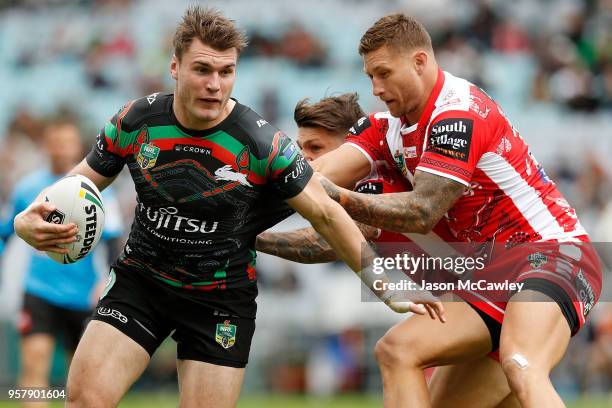 Angus Crichton of the Rabbitohs is tackled by Tariq Sims of the Dragons during the round 10 NRL match between the South Sydney Rabbitohs and the St...