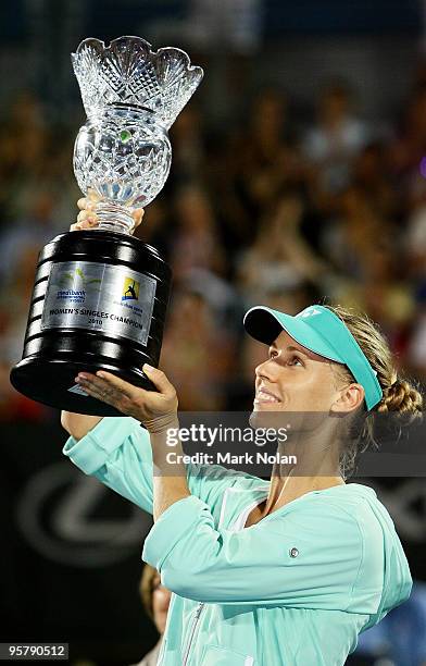 Elena Dementieva of Russia holds the trophy aloft after winning the women's final match against Serena Williams of the USA during day six of the 2010...