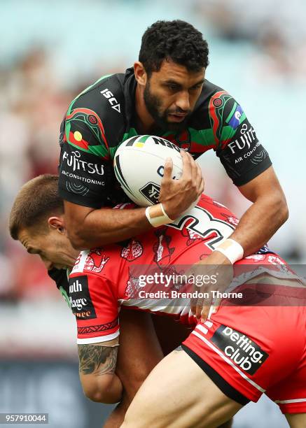 Alex Johnston of the Rabbitohs is tackled by Euan Aitken of the Dragons during the round 10 NRL match between the South Sydney Rabbitohs and the St...