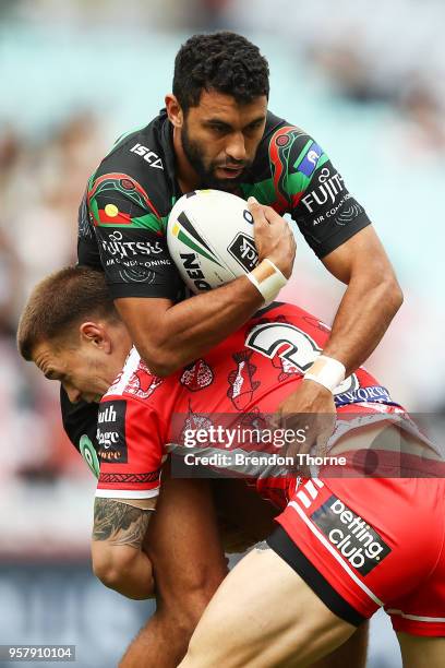 Alex Johnston of the Rabbitohs is tackled by Euan Aitken of the Dragons during the round 10 NRL match between the South Sydney Rabbitohs and the St...