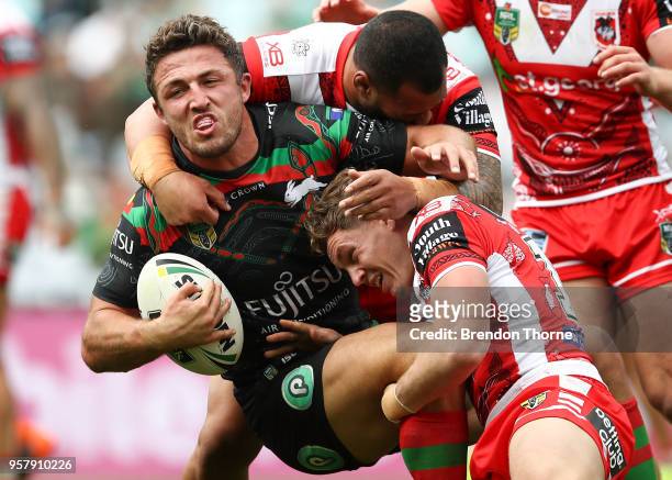Samuel Burgess of the Rabbitohs is tackled by the Dragons defence during the round 10 NRL match between the South Sydney Rabbitohs and the St George...