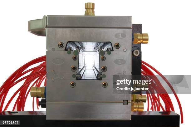 metal mold extruding red plastic - extrusion stock pictures, royalty-free photos & images