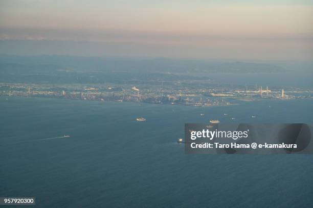 tankers sailing on tokyo bay in japan sunset time aerial view from airplane - 東京湾 ストックフォトと画像