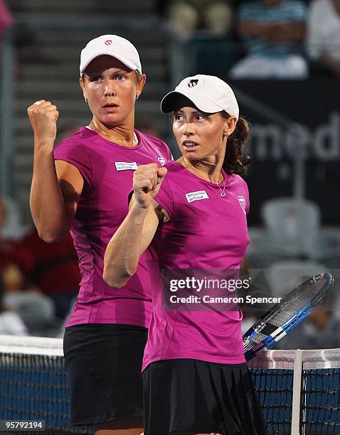 Liezel Huber of the USA and Cara Black of Zimbabwe celebrate match point in their women's doubles final match against Tathiana Garbin of Italy and...