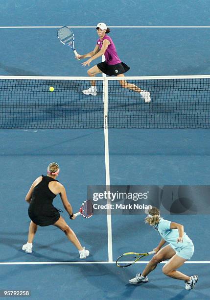 Cara Black of the USA prepares to volley in her womens doubles final match with Liezel Huber of the USA against Nadia Petrova of Russia and Tathiana...