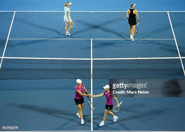 Liezel Huber of the USA and Cara Black celebrate a point in their womens doubles final match against Nadia Petrova of Russia and Tathiana Garbin of...