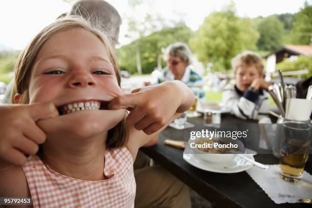 young girl making a grimace - making a face bildbanksfoton och bilder