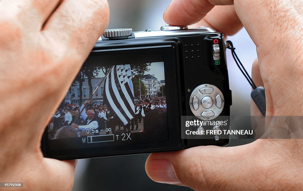 A man takes a picture on August 2, 2009