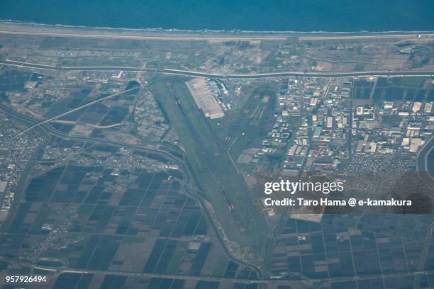 northern pacific ocean and sendai international airport in japan sunset time aerial view from airplane - sendai airport stock pictures, royalty-free photos & images