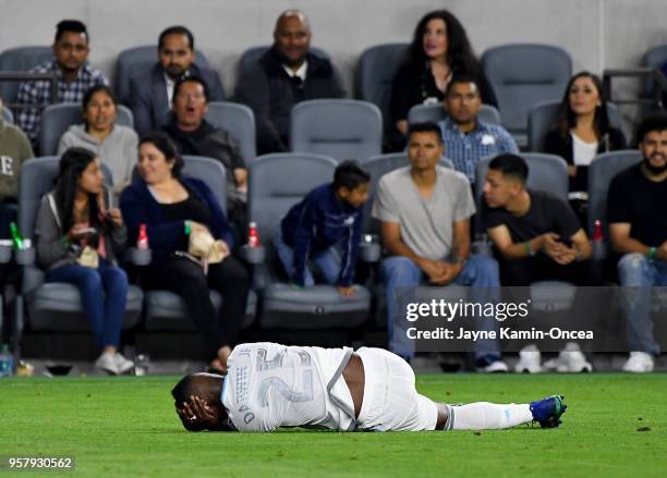 Fans look on as Walker Zimmerman of Los Angeles FC holds his head as he lays on the ground during the game against the Minnesota United at Banc of...