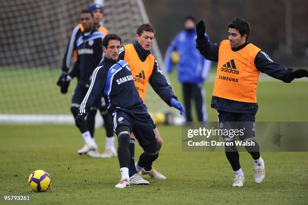 Juliano Belletti and Nemanja Matic and Deco of Chelsea during a training session at the Cobham training ground on January 15, 2010 in Cobham, England.