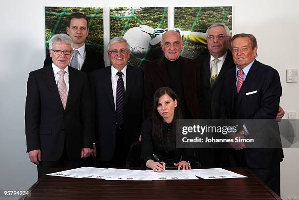 Teresa Enke , widow of goalkeeper Robert Enke signs the charter of the Robert Enke Foundation in presence of DFB officials Reinhard Rauball, Oliver...