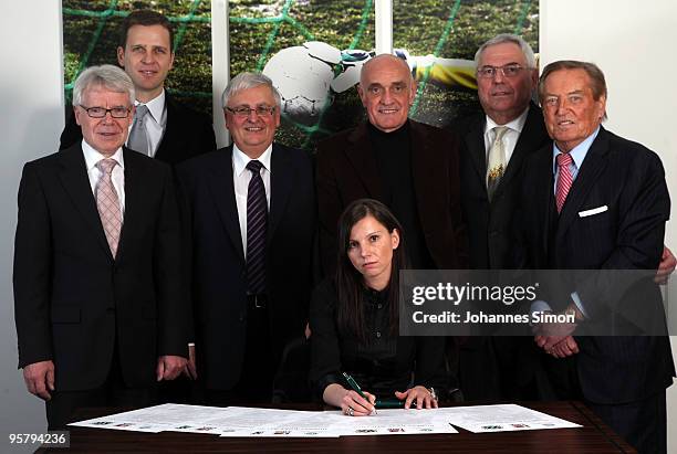 Teresa Enke , widow of goalkeeper Robert Enke signs the charter of the Robert Enke Foundation in presence of DFB officials Reinhard Rauball, Oliver...