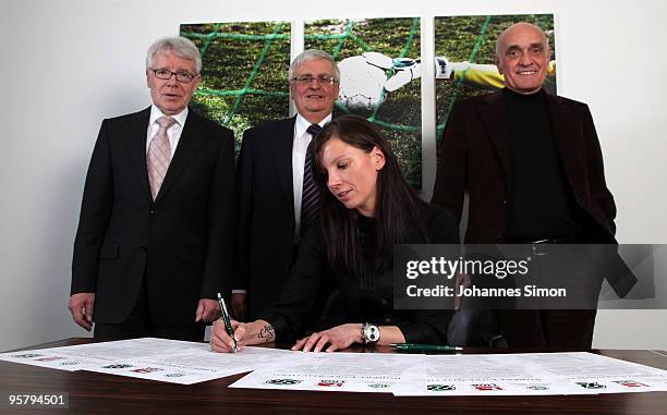 Teresa Enke , widow of goalkeeper Robert Enke signs the charter of the Robert Enke Foundation in presence of DFB officials Reinhard Rauball, Theo...