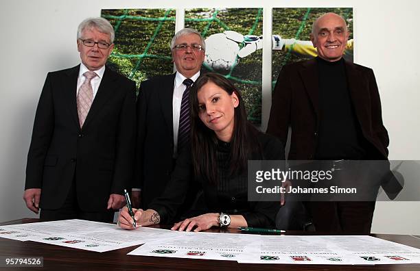 Teresa Enke , widow of goalkeeper Robert Enke signs the charter of the Robert Enke Foundation in presence of DFB officials Reinhard Rauball, Theo...