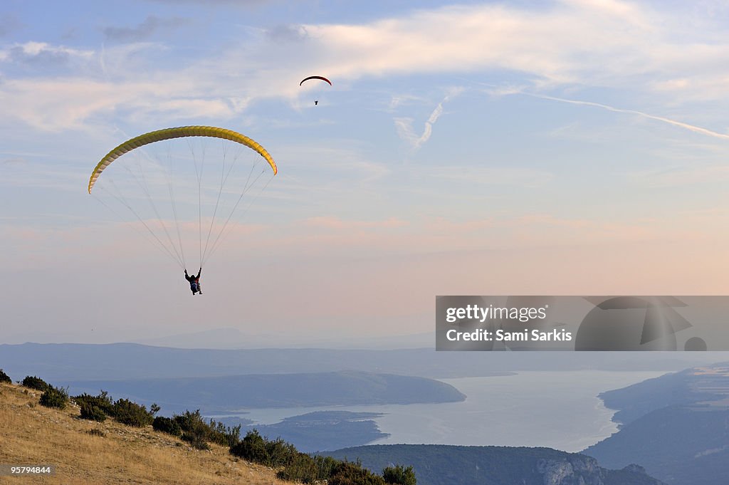 Paragliders flying at sunset, Sainte-Croix lake