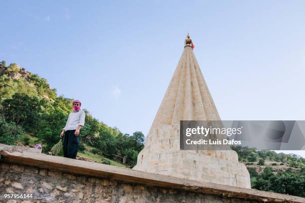 yazidi pilgrim at lalish temple - conical roof stock pictures, royalty-free photos & images