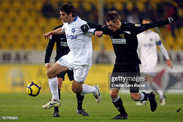 Lars Stindl of Karlsruhe is challenged by Manuel Junglas of Aachen during the Second Bundesliga match between Alemannia Aachen and Karlsruher SC at...