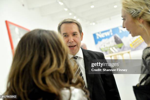 Artist Jeff Koons discusses his work with a guest during the Hirshhorn Museum 2018 Spring Gala at the Hirshhorn Museum and Sculpture Garden on May...