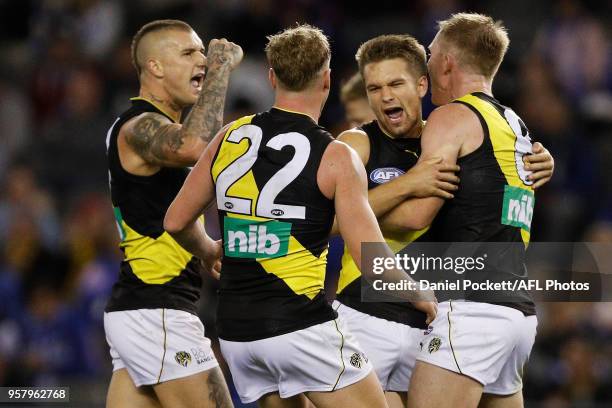 Dan Butler of the Tigers celebrates a goal during the 2018 AFL round eight match between the North Melbourne Kangaroos and the Richmond Tigers at...