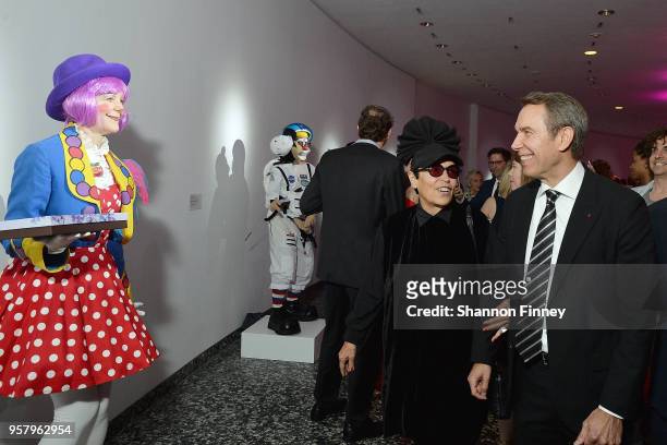 Artist Jeff Koons and Mera Rubell , mother of conceptual artist Jennifer Rubell, interacts with Jennifer Rubell's dessert performance during the...