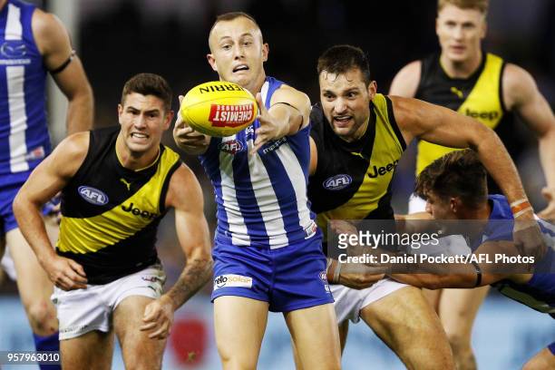 Billy Hartung of the Kangaroos reaches for the ball during the 2018 AFL round eight match between the North Melbourne Kangaroos and the Richmond...