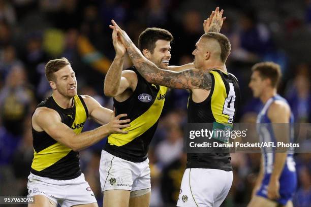 Trent Cotchin of the Tigers celebrates a goal during the 2018 AFL round eight match between the North Melbourne Kangaroos and the Richmond Tigers at...