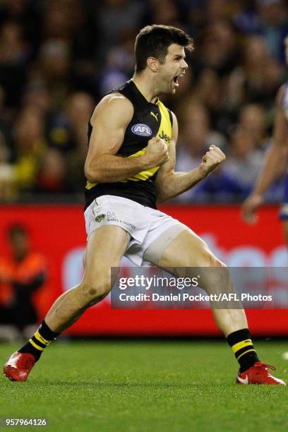 Trent Cotchin of the Tigers celebrates a goal during the 2018 AFL round eight match between the North Melbourne Kangaroos and the Richmond Tigers at...