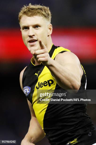 Josh Caddy of the Tigers celebrates a goal during the 2018 AFL round eight match between the North Melbourne Kangaroos and the Richmond Tigers at...