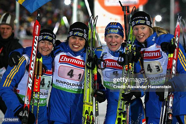 Anna Carin Olofsson-Zidek, Elisabeth Hoegberg, Anna Maria Nilsson and Helena Jonsson of team Sweden wins the Women's 4 x 6km Relay in the e.on...