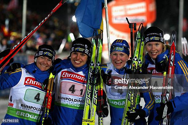 Anna Carin Olofsson-Zidek, Elisabeth Hoegberg, Anna Maria Nilsson and Helena Jonsson of team Sweden wins the Women's 4 x 6km Relay in the e.on...