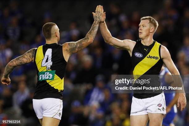 Jack Riewoldt of the Tigers celebrates a goal with Dustin Martin of the Tigers during the 2018 AFL round eight match between the North Melbourne...