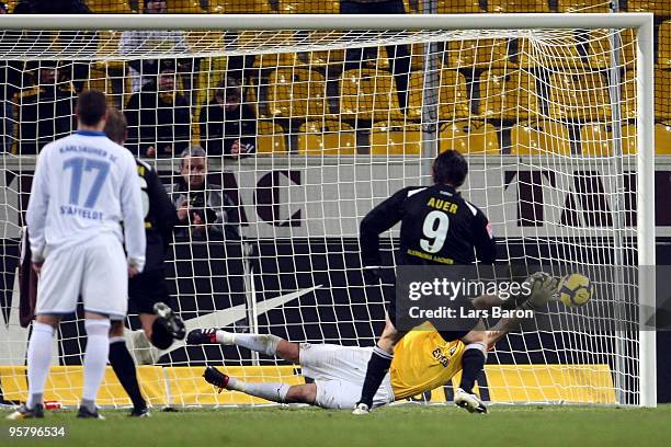 Goalkeeper Markus Miller of Karlsruhe saves a penalty kicked by Benjamin Auer of Aachen during the Second Bundesliga match between Alemannia Aachen...