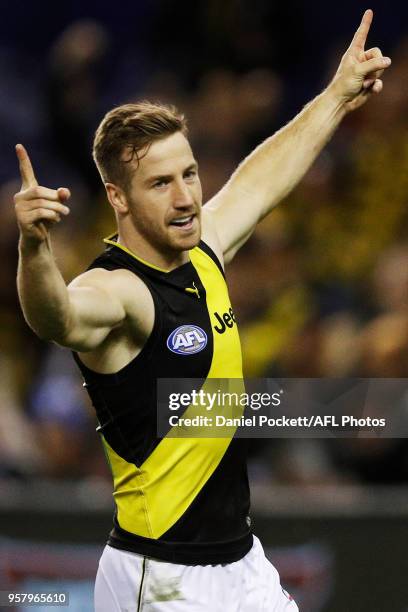 Kane Lambert of the Tigers celebrates a goal during the 2018 AFL round eight match between the North Melbourne Kangaroos and the Richmond Tigers at...