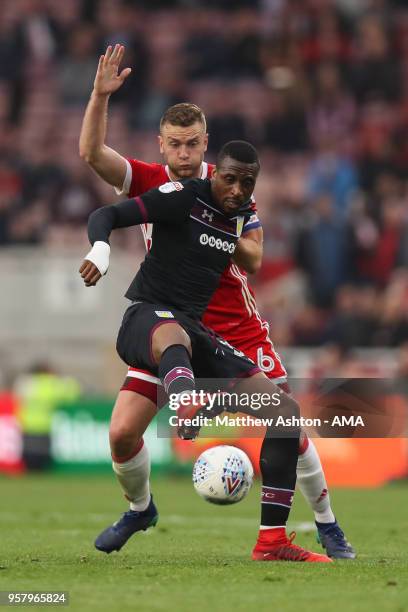 Albert Adomah of Aston Villa and Benjamin Gibson of Middlesbrough during the Sky Bet Championship Play Off Semi Final First Leg match between...