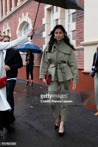Jessica Gomes wearing Camilla and Marc suit and Stella McCartney clutch during Mercedes-Benz Fashion Week Resort 19 Collections at Royal Hall of...